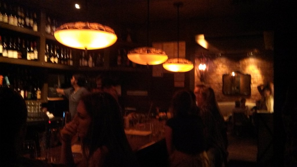 View of the bar with dining room in background